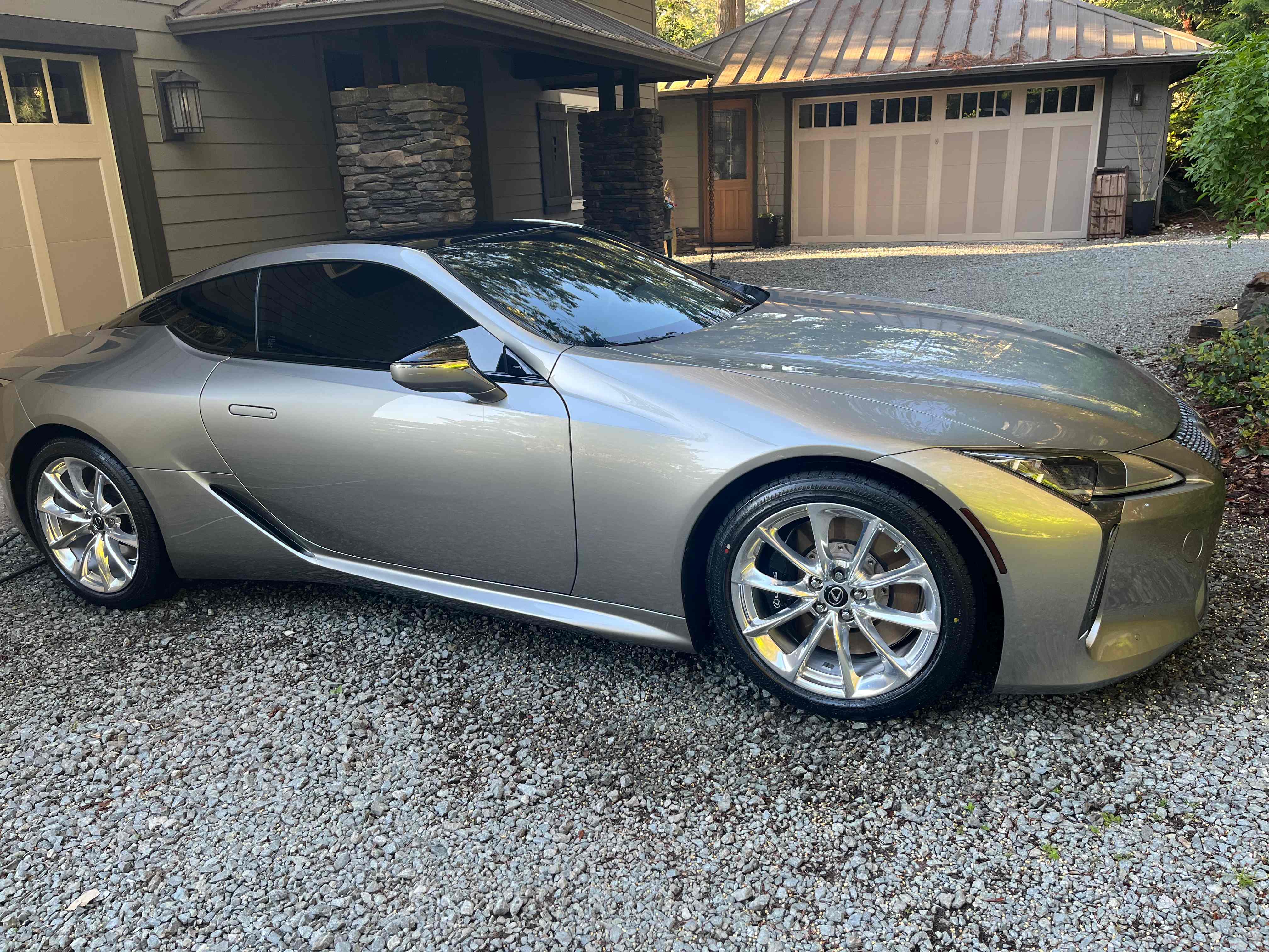 Silver Lexus sports coupe with mirror-like finish